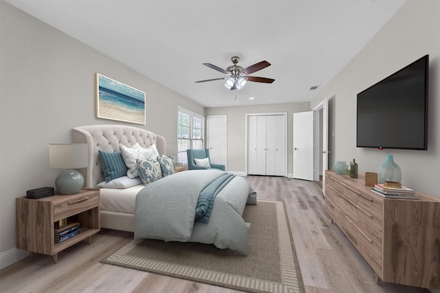 501 S Eddy Ave, Denison, TX 75020 - bedroom featuring light wood-style flooring, two closets, and a ceiling fan