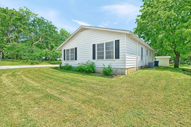 501 S Eddy Ave, Denison, TX 75020 - view of side of property with a yard and a central air condition unit
