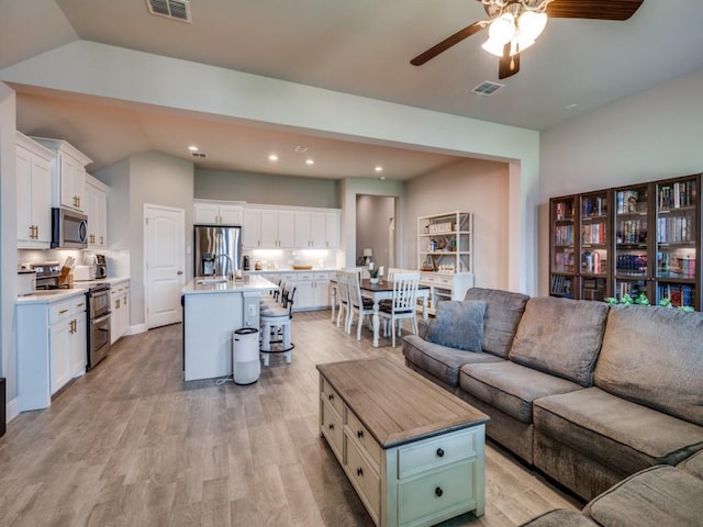 11724 Pistachio Trl, Fort Worth, TX 76108 - living area with ceiling fan, vaulted ceiling, light wood-type flooring, and recessed lighting