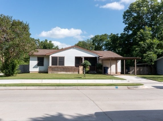 114 Wilmington Ave, Waxahachie, TX 75165 - ranch-style house with concrete driveway and a garage