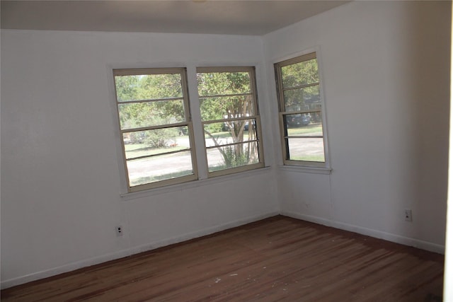 114 Wilmington Ave, Waxahachie, TX 75165 - empty room with wood finished floors and baseboards