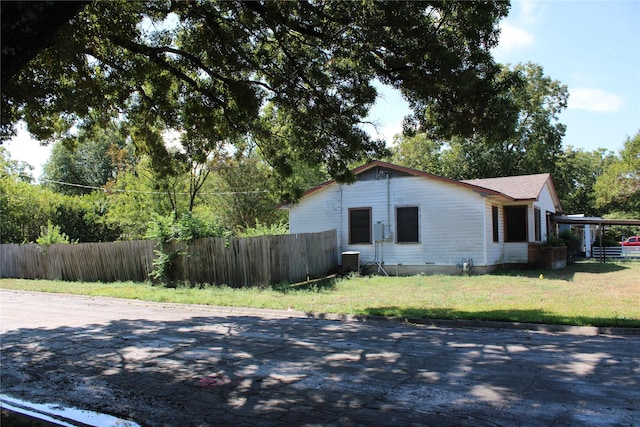 114 Wilmington Ave, Waxahachie, TX 75165 - view of property exterior featuring a carport and central AC unit