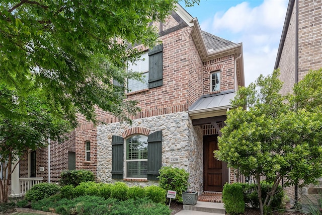 7320 San Saba Dr, Mckinney, TX 75070 - view of front facade with brick siding, stone siding, and a standing seam roof