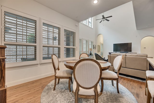 7320 San Saba Dr, Mckinney, TX 75070 - dining space featuring arched walkways, ceiling fan, light wood finished floors, and recessed lighting