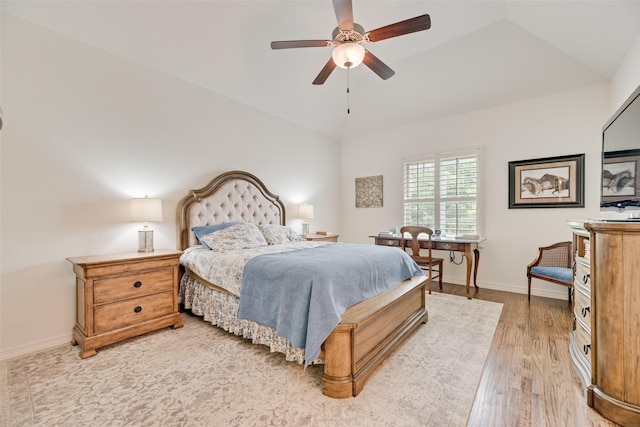 7320 San Saba Dr, Mckinney, TX 75070 - bedroom with light wood-style flooring, lofted ceiling, and a ceiling fan