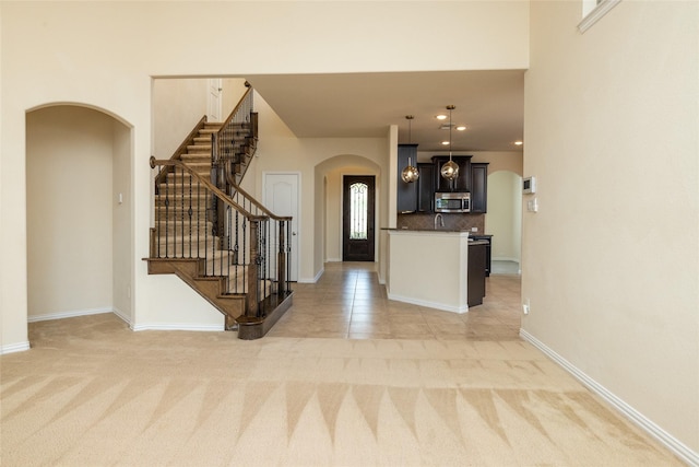 513 Northwyck Ln, Keller, TX 76248 - foyer featuring arched walkways, light carpet, baseboards, and recessed lighting