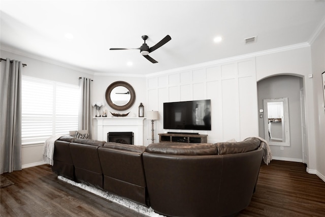 4804 Spicewood Ln, Arlington, TX 76017 - living area featuring a ceiling fan, a fireplace, dark wood-style flooring, crown molding, and baseboards