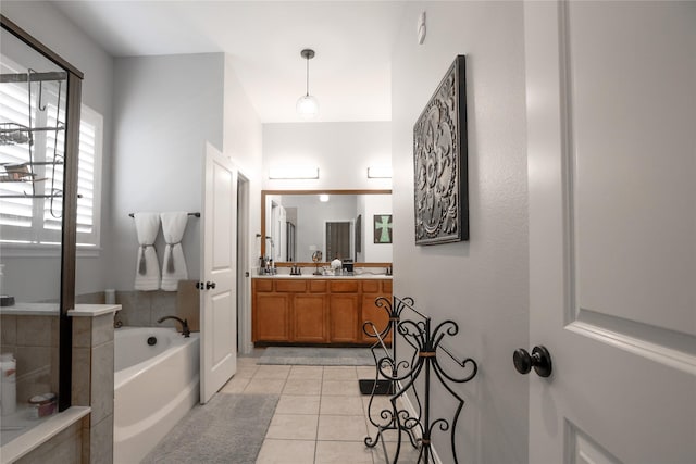 4804 Spicewood Ln, Arlington, TX 76017 - full bathroom featuring a bath, double vanity, and tile patterned flooring