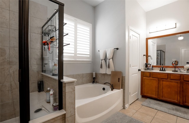 4804 Spicewood Ln, Arlington, TX 76017 - full bath featuring a bath, a stall shower, vanity, and tile patterned flooring