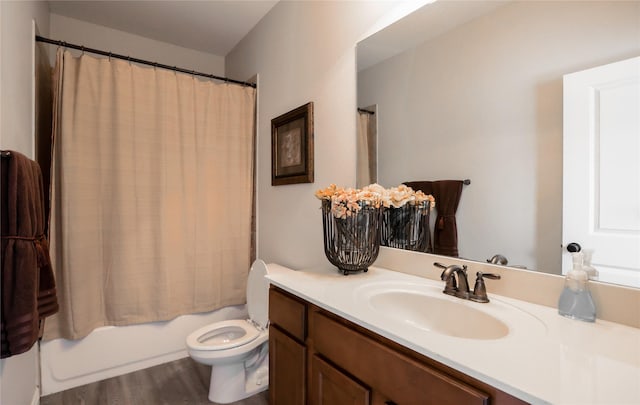 4804 Spicewood Ln, Arlington, TX 76017 - bathroom featuring vanity, toilet, shower / bath combo, and wood finished floors