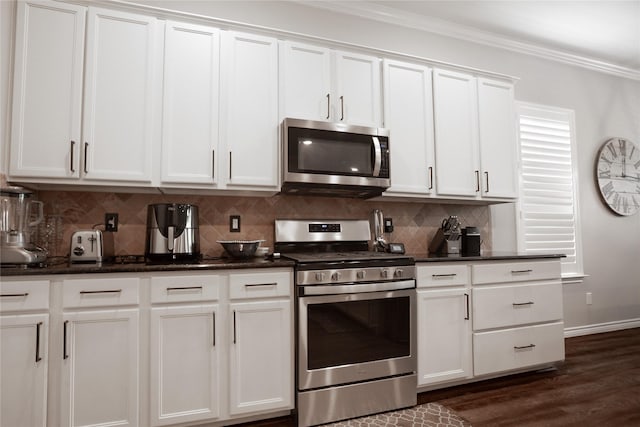 4804 Spicewood Ln, Arlington, TX 76017 - kitchen featuring appliances with stainless steel finishes, tasteful backsplash, white cabinets, ornamental molding, and dark stone counters