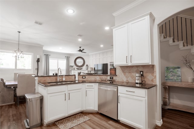 4804 Spicewood Ln, Arlington, TX 76017 - kitchen featuring stainless steel dishwasher, a sink, tasteful backsplash, ornamental molding, and light wood-type flooring