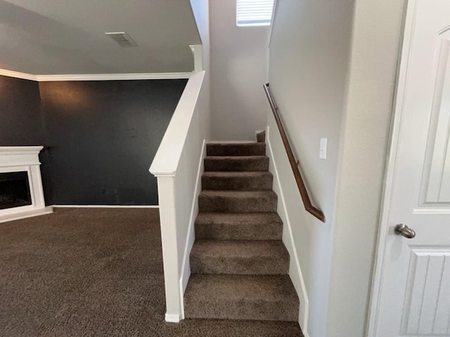 3000 Buckthorn St, Forney, TX 75126 - stairway with carpet floors, crown molding, baseboards, and a fireplace with raised hearth