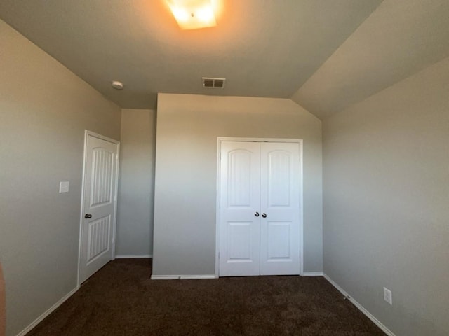 3000 Buckthorn St, Forney, TX 75126 - unfurnished bedroom featuring dark carpet, a closet, baseboards, and vaulted ceiling