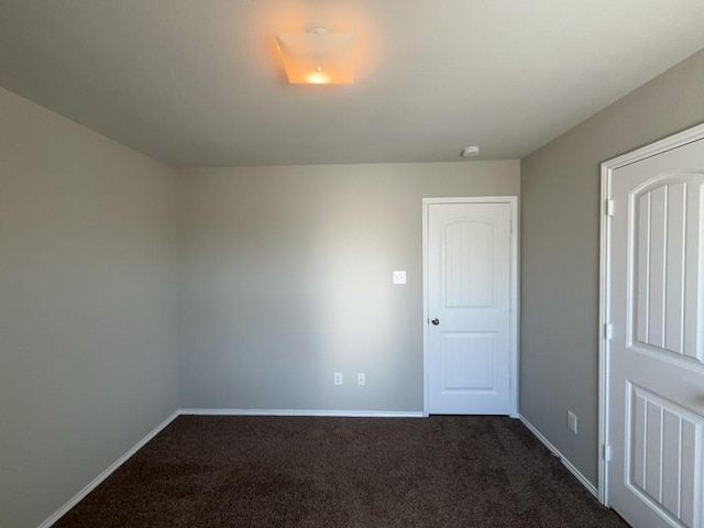 3000 Buckthorn St, Forney, TX 75126 - empty room with dark colored carpet, baseboards, and a smoke detector