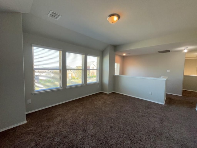 3000 Buckthorn St, Forney, TX 75126 - empty room featuring dark carpet, baseboards, and vaulted ceiling
