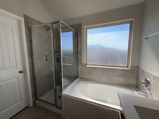 3000 Buckthorn St, Forney, TX 75126 - full bathroom featuring a stall shower, a bath, tile patterned floors, and lofted ceiling