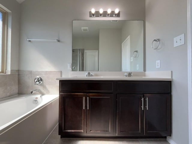 3000 Buckthorn St, Forney, TX 75126 - full bathroom with double vanity, a bath, healthy amount of natural light, and a shower stall