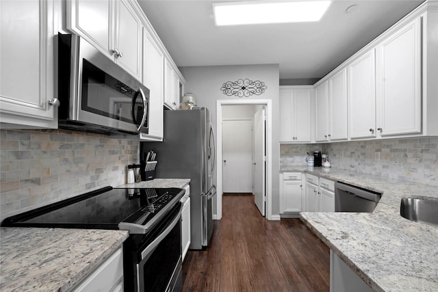3421 Paisano Trl, Plano, TX 75093 - kitchen with appliances with stainless steel finishes, white cabinetry, and decorative backsplash