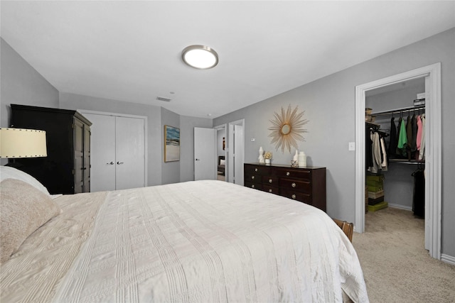 3421 Paisano Trl, Plano, TX 75093 - bedroom featuring a closet, light carpet, baseboards, and a spacious closet