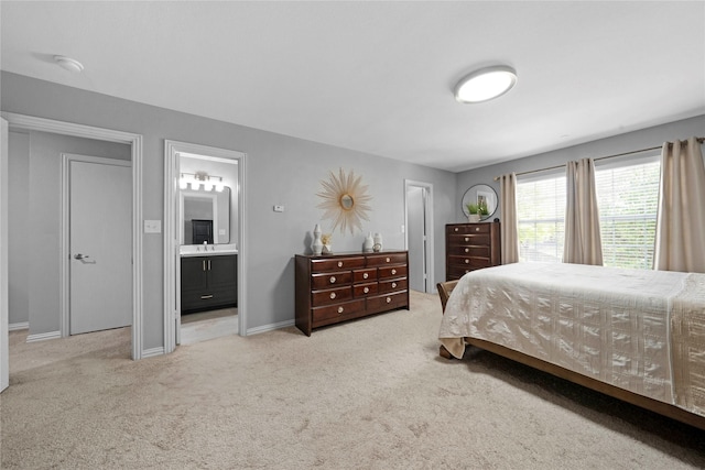 3421 Paisano Trl, Plano, TX 75093 - carpeted bedroom featuring ensuite bathroom and baseboards
