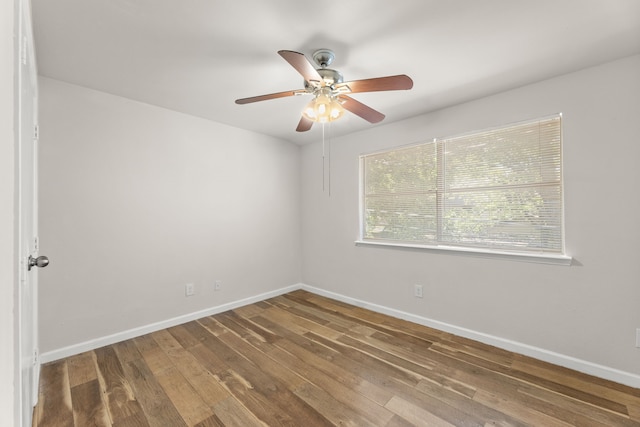 531 Norwood Cir E, Arlington, TX 76013 - spare room with hardwood / wood-style floors, a ceiling fan, and baseboards
