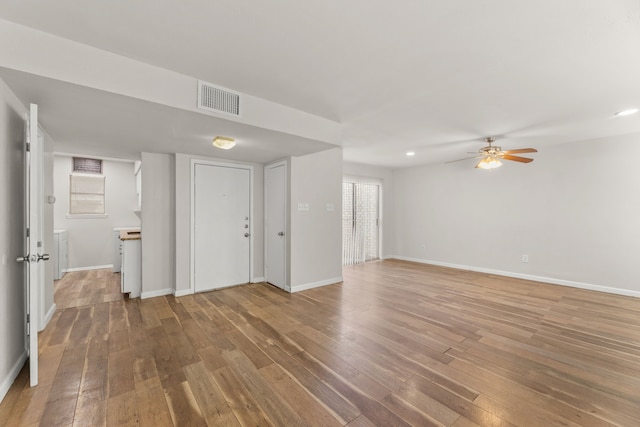 531 Norwood Cir E, Arlington, TX 76013 - unfurnished living room featuring wood-type flooring, ceiling fan, baseboards, and recessed lighting