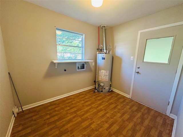 202 Wanda Dr, Winnsboro, TX 75494 - laundry area featuring gas water heater, washer hookup, wood finished floors, electric dryer hookup, and baseboards