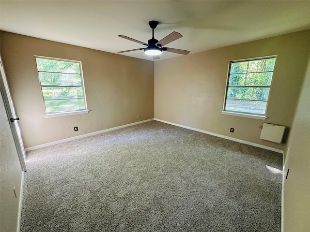202 Wanda Dr, Winnsboro, TX 75494 - spare room with healthy amount of natural light, a ceiling fan, carpet, and baseboards
