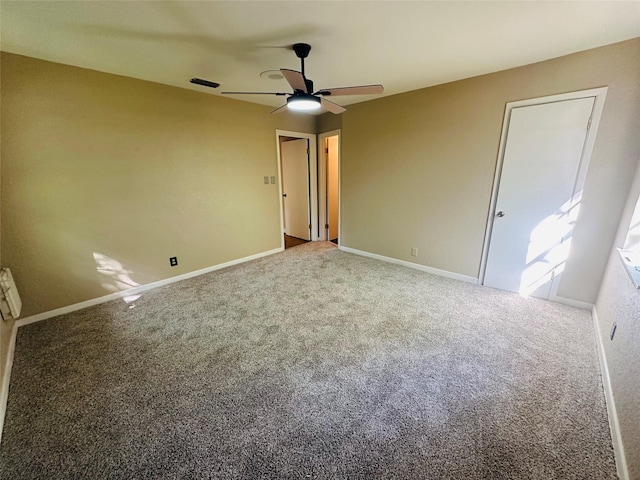 202 Wanda Dr, Winnsboro, TX 75494 - unfurnished bedroom with carpet, baseboards, and ceiling fan