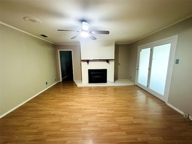202 Wanda Dr, Winnsboro, TX 75494 - unfurnished living room with ornamental molding, ceiling fan, light wood-style floors, a fireplace with raised hearth, and baseboards