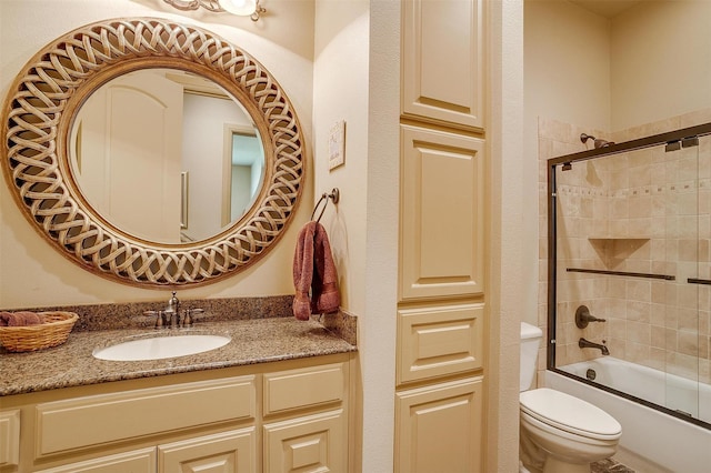 6700 Lions Gate Ct, Arlington, TX 76001 - bathroom featuring toilet, vanity, and bath / shower combo with glass door