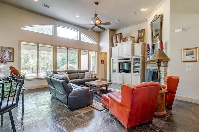 6700 Lions Gate Ct, Arlington, TX 76001 - living room with baseboards, ornamental molding, a ceiling fan, recessed lighting, and arched walkways