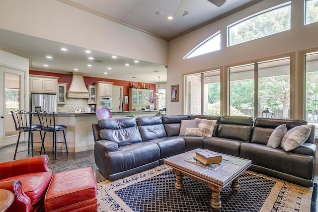 6700 Lions Gate Ct, Arlington, TX 76001 - living room featuring ornamental molding, recessed lighting, and a high ceiling