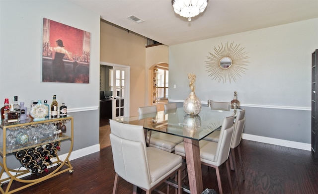 9521 Cholla Cactus Trl, Fort Worth, TX 76177 - dining area featuring arched walkways, baseboards, and dark wood-style floors
