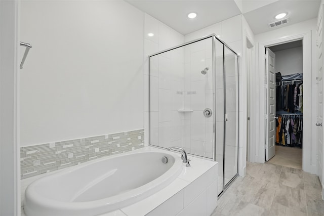 4008 Prickly Pear Ave, Aubrey, TX 76227 - bathroom featuring a spacious closet, a stall shower, a bath, and recessed lighting