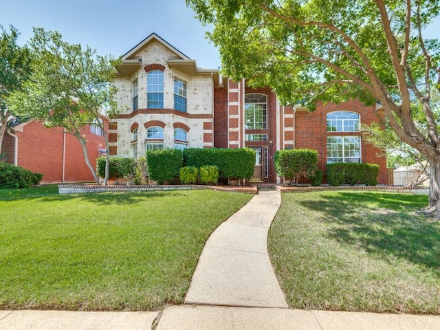 2540 Briardale Dr, Carrollton, TX 75006 - view of front facade featuring a front yard and brick siding