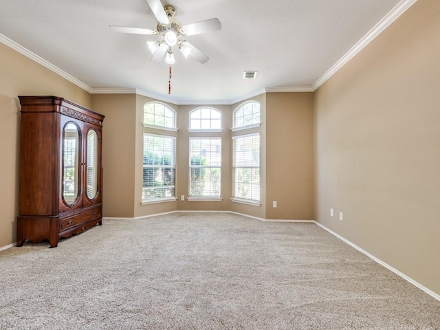 2540 Briardale Dr, Carrollton, TX 75006 - carpeted spare room featuring crown molding, a ceiling fan, and baseboards