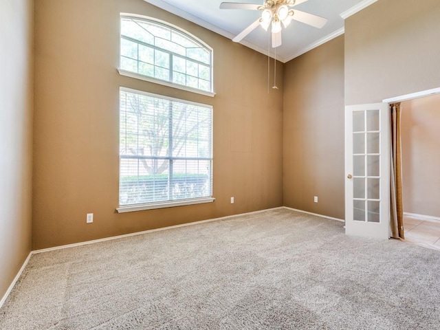 2540 Briardale Dr, Carrollton, TX 75006 - empty room with ornamental molding, carpet, ceiling fan, baseboards, and a towering ceiling