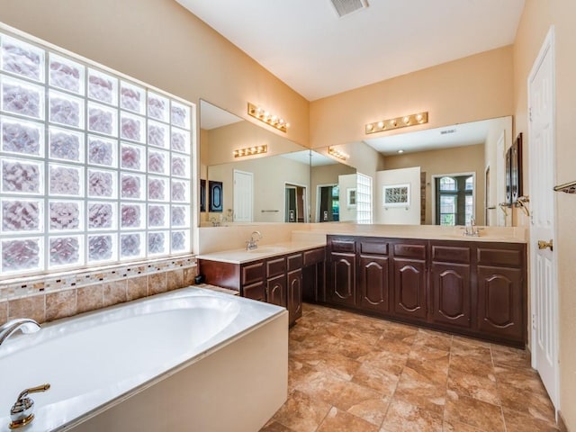2540 Briardale Dr, Carrollton, TX 75006 - full bathroom featuring a garden tub and vanity