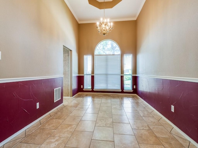 2540 Briardale Dr, Carrollton, TX 75006 - empty room featuring a chandelier, crown molding, a high ceiling, and baseboards