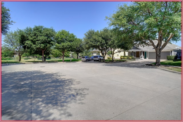 5005 Odeum Ct, Fort Worth, TX 76244 - view of concrete road with curbs and sidewalks