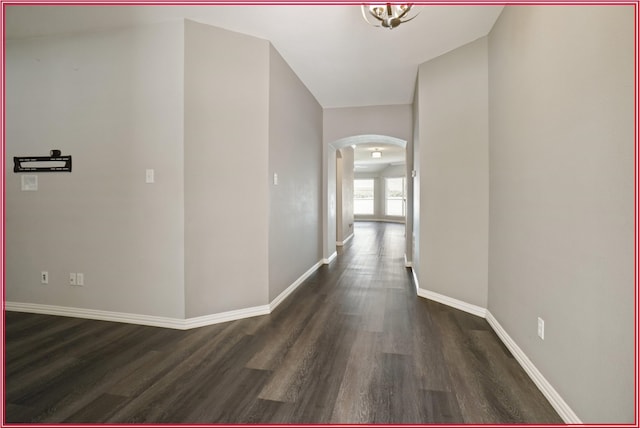 5005 Odeum Ct, Fort Worth, TX 76244 - hall featuring arched walkways, dark wood-style flooring, and baseboards