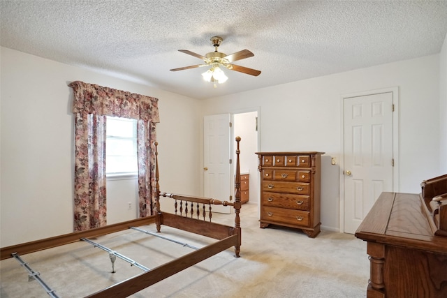 1508 Raborn Dr, Bowie, TX 76230 - bedroom featuring light colored carpet, a textured ceiling, baseboards, and ceiling fan