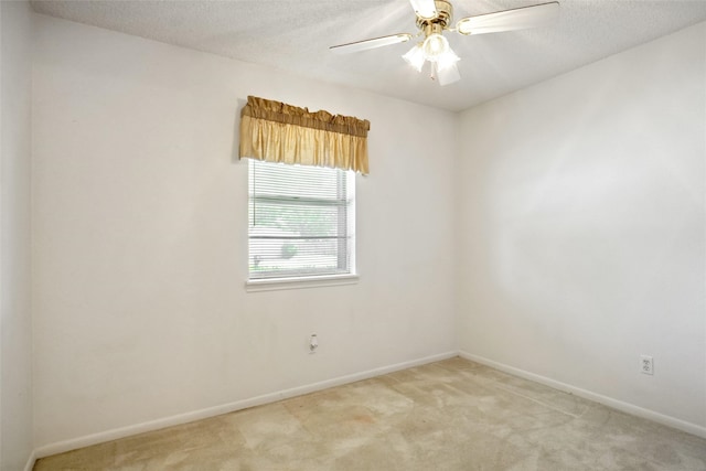 1508 Raborn Dr, Bowie, TX 76230 - spare room featuring light carpet, baseboards, ceiling fan, and a textured ceiling