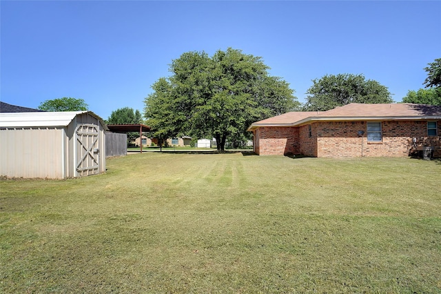 1508 Raborn Dr, Bowie, TX 76230 - view of grassy yard with an outdoor structure and a storage shed