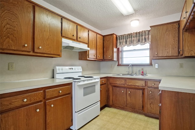 1508 Raborn Dr, Bowie, TX 76230 - kitchen with under cabinet range hood, electric stove, a sink, light floors, and brown cabinets