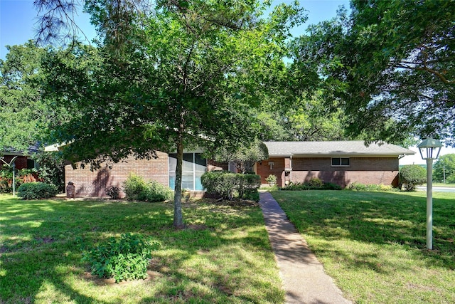 1512 Hulme St, Bowie, TX 76230 - view of front of property featuring brick siding and a front lawn