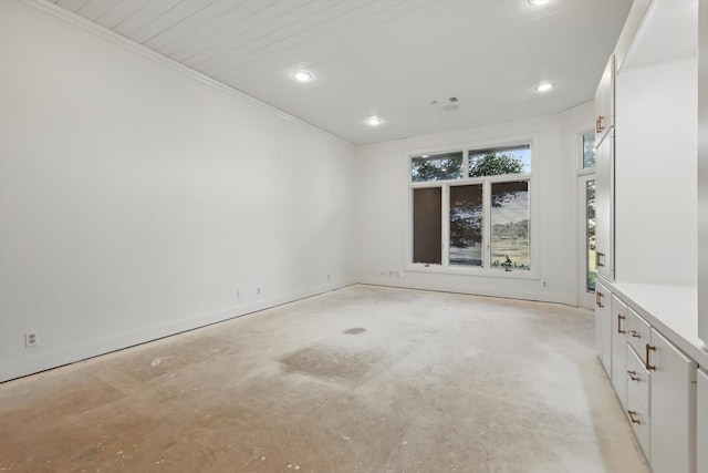 1424 Hidden Oaks Cir, Corinth, TX 76210 - empty room with unfinished concrete flooring, recessed lighting, and baseboards