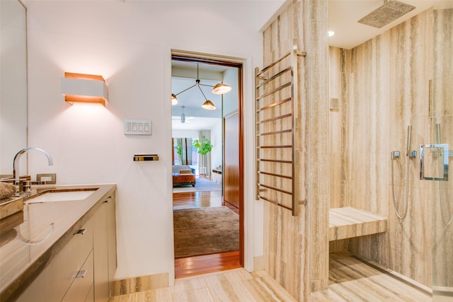 5848 Colhurst St, Dallas, TX 75230 - ensuite bathroom with a walk in shower, vanity, and wood finished floors